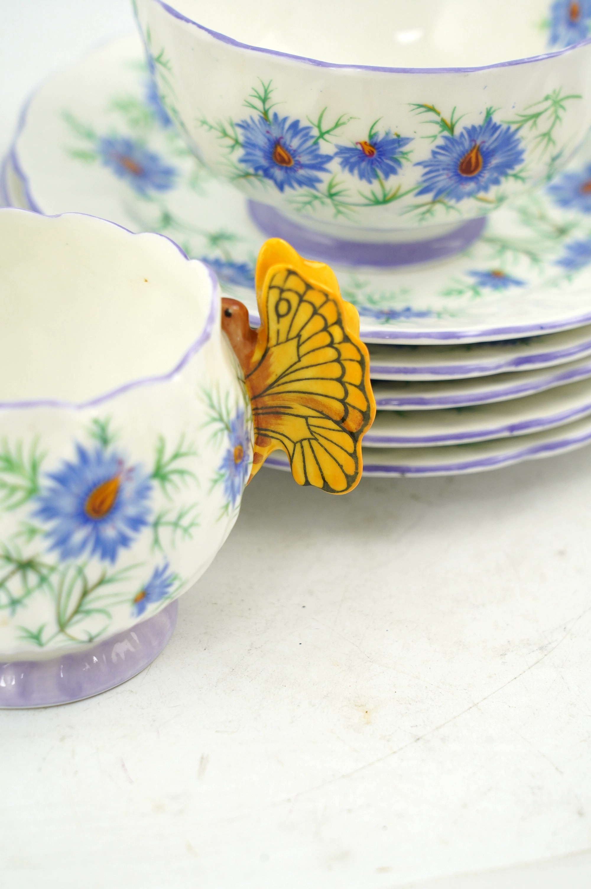 An Art Deco Aynsley cornflower pattern bone china twenty piece part tea set with butterfly handles